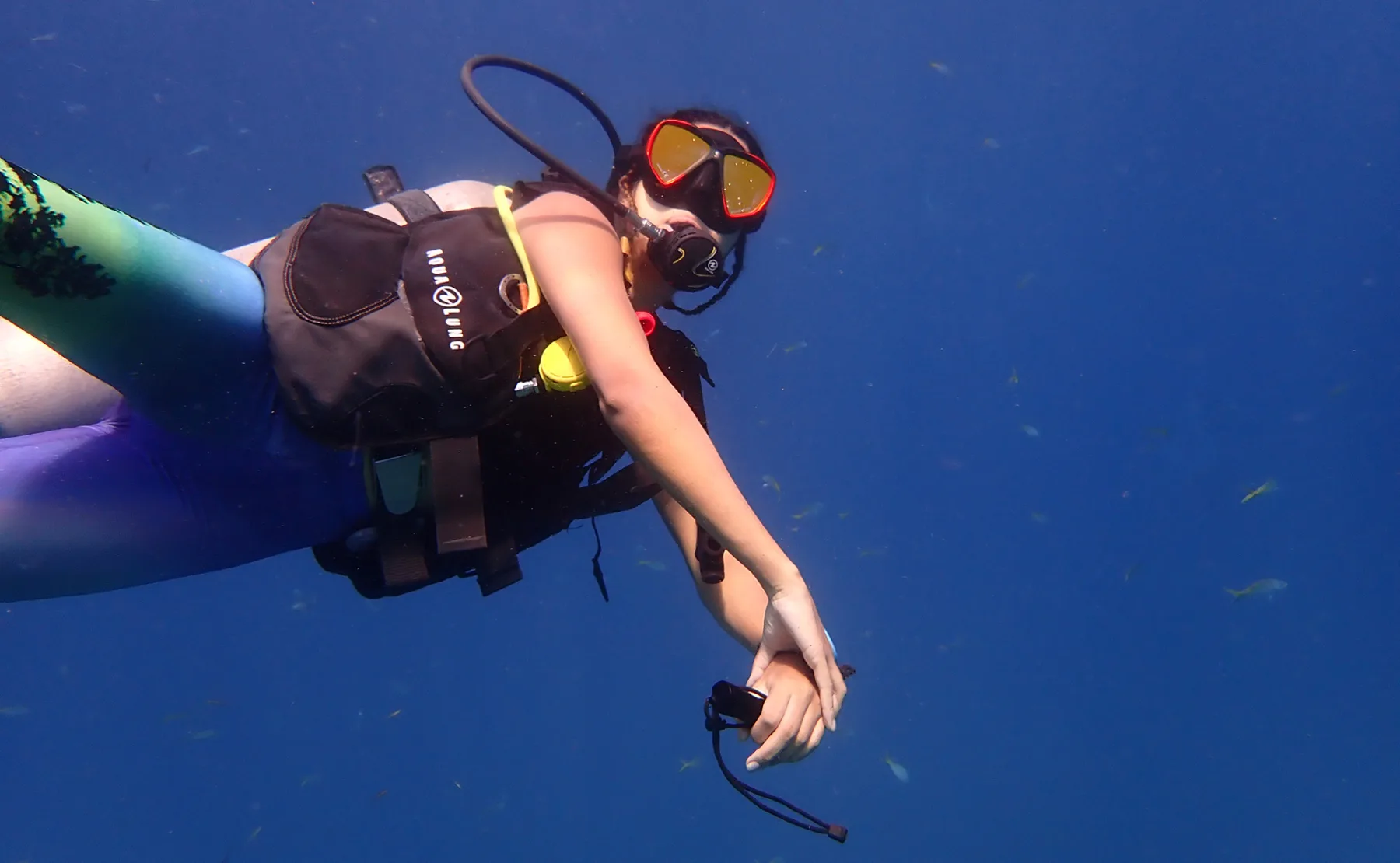 scuba diver underwater wearing Aqualung bcd