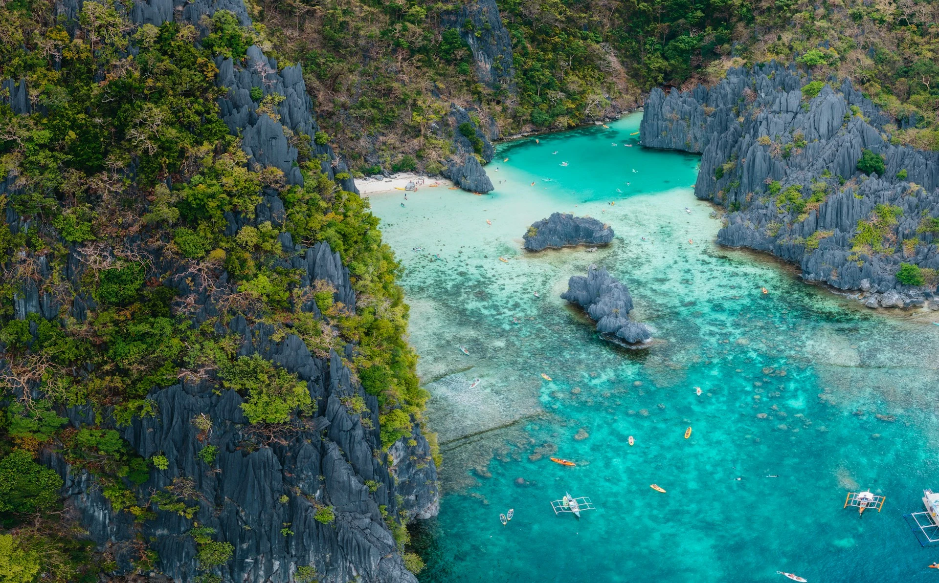 Aerial view of karst limestone islands and turquoise lagoons in the Philippines, Coral Triangle