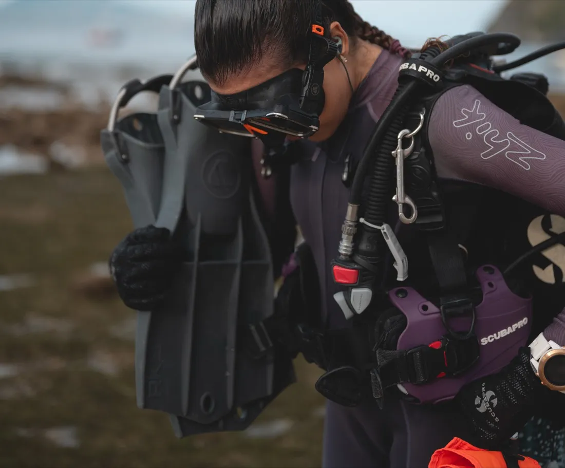 Caro Santamaria in scuba gear on the shore