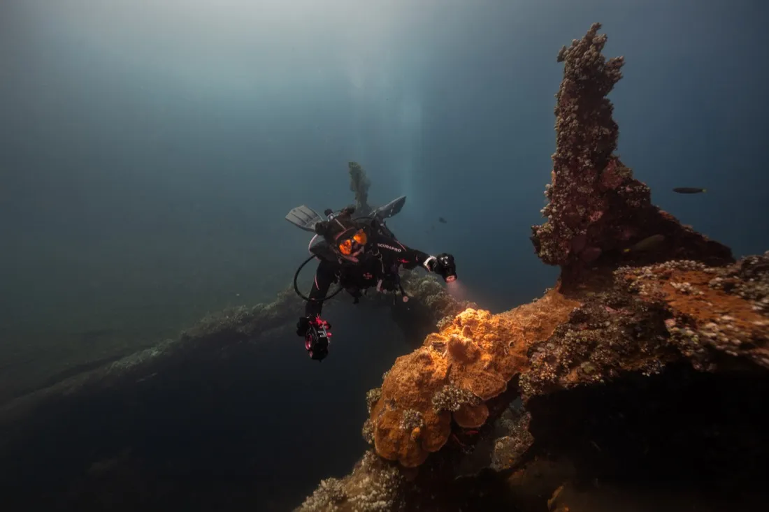 Caro Santamaria scuba diving near a shipwreck
