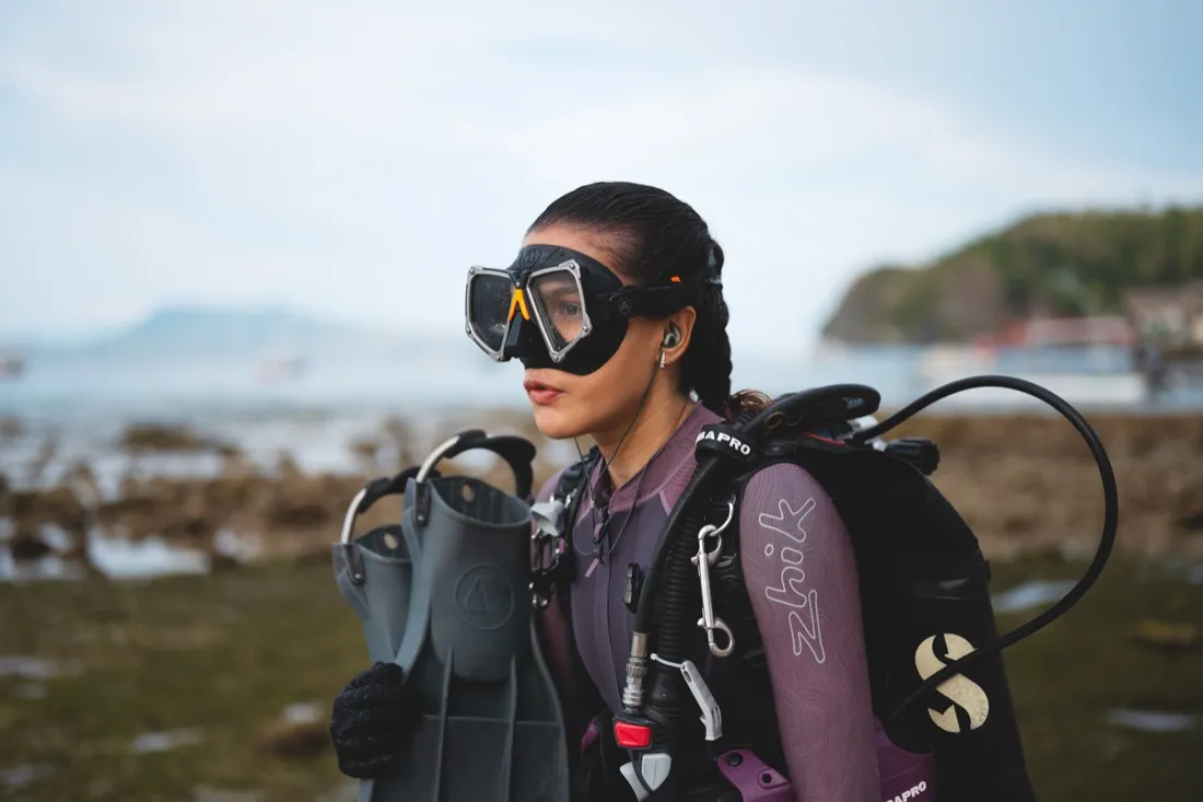 Caro Santamaria in full scuba gear on the shore